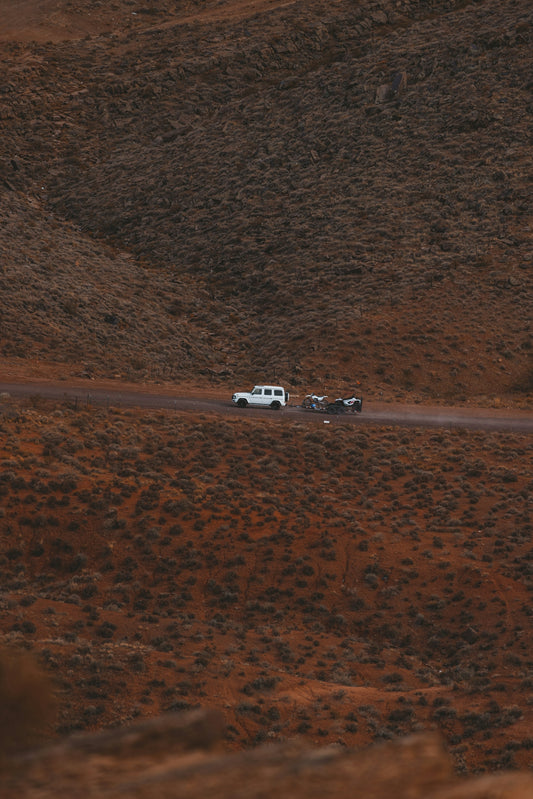 a group of vehicles driving down a road