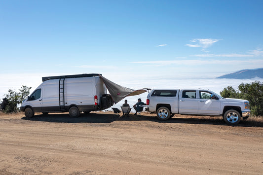 white van on brown sand during daytime