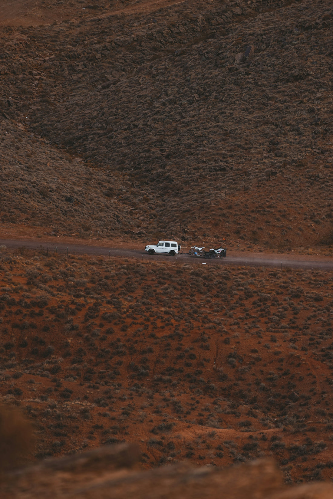 a group of vehicles driving down a road